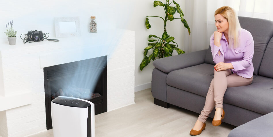 Women watching Air Purifier clean the Air in Living Room